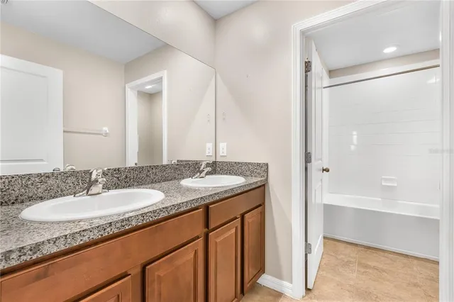 a bathroom with a toilet and a bathtub