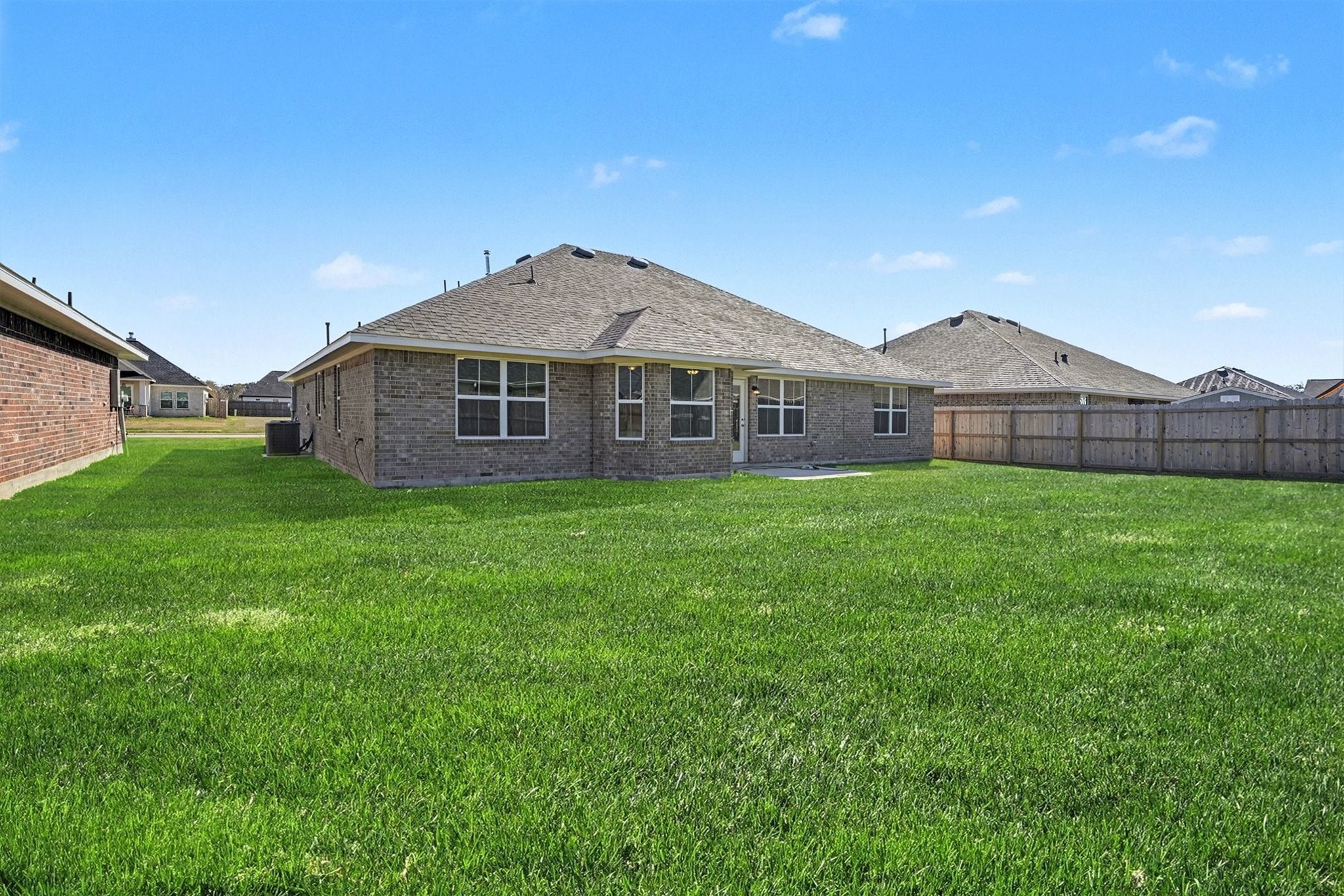 5 Keystone Court Angleton, TX 77515 - Photo 32 of 33 a front view of a house with garden
