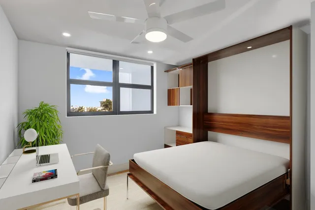 a room with a bed and a window