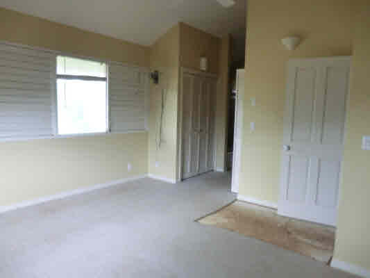 4439 Kaloloku Road, Unit A Kapaa, HI 96746 - Photo 11 of 17 an empty room with windows and closet