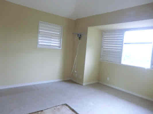4439 Kaloloku Road, Unit A Kapaa, HI 96746 - Photo 12 of 17 an empty room with windows