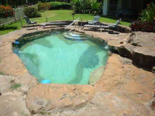 4439 Kaloloku Road, Unit A Kapaa, HI 96746 - Photo 13 of 17 a view of a lake with a park