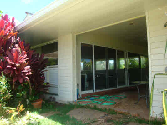 4439 Kaloloku Road, Unit A Kapaa, HI 96746 - Photo 14 of 17 a backyard of a house with plants and tree