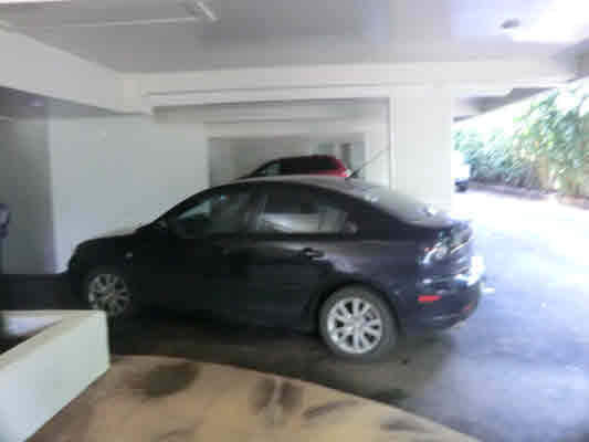4439 Kaloloku Road, Unit A Kapaa, HI 96746 - Photo 8 of 17 a black car parked in a garage