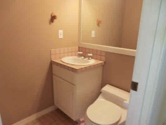 4439 Kaloloku Road, Unit A Kapaa, HI 96746 - Photo 9 of 17 a bathroom with a sink and toilet