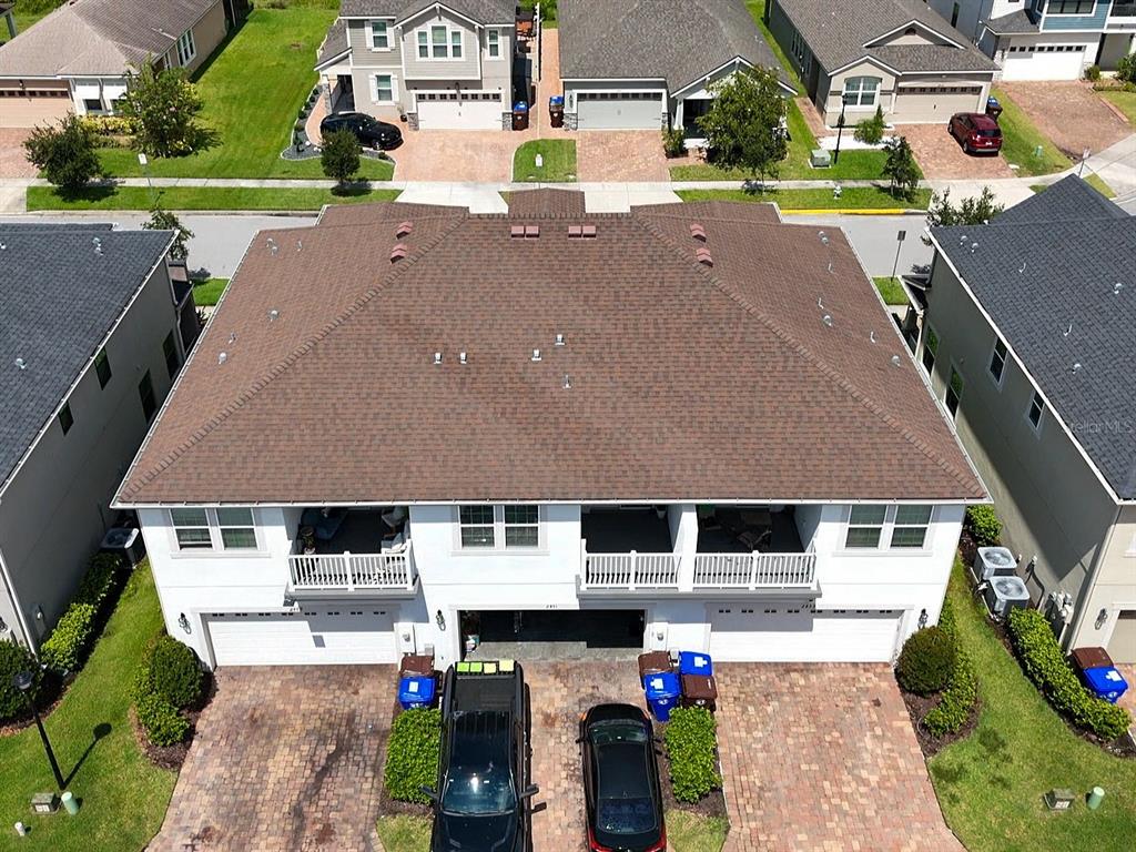 2451 Varenna Loop Kissimmee, FL 34741 - Photo 2 of 11 a aerial view of a house with swimming pool