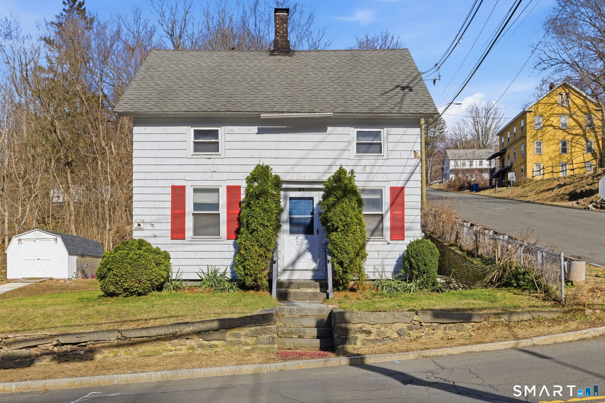 a front view of house with small garden