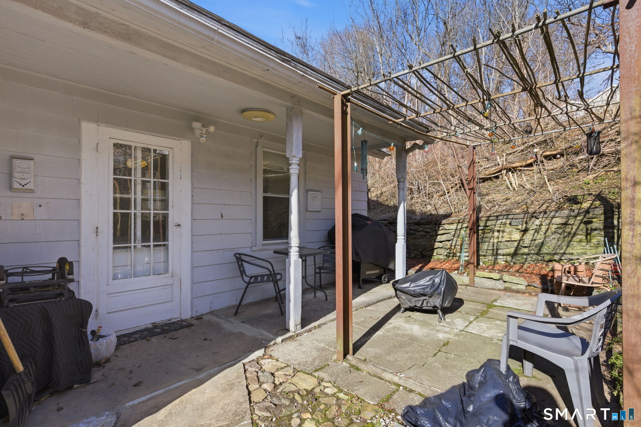 Undisclosed Address Vernon, CT 06066 - Photo 13 of 31 a backyard of a house with outdoor seating