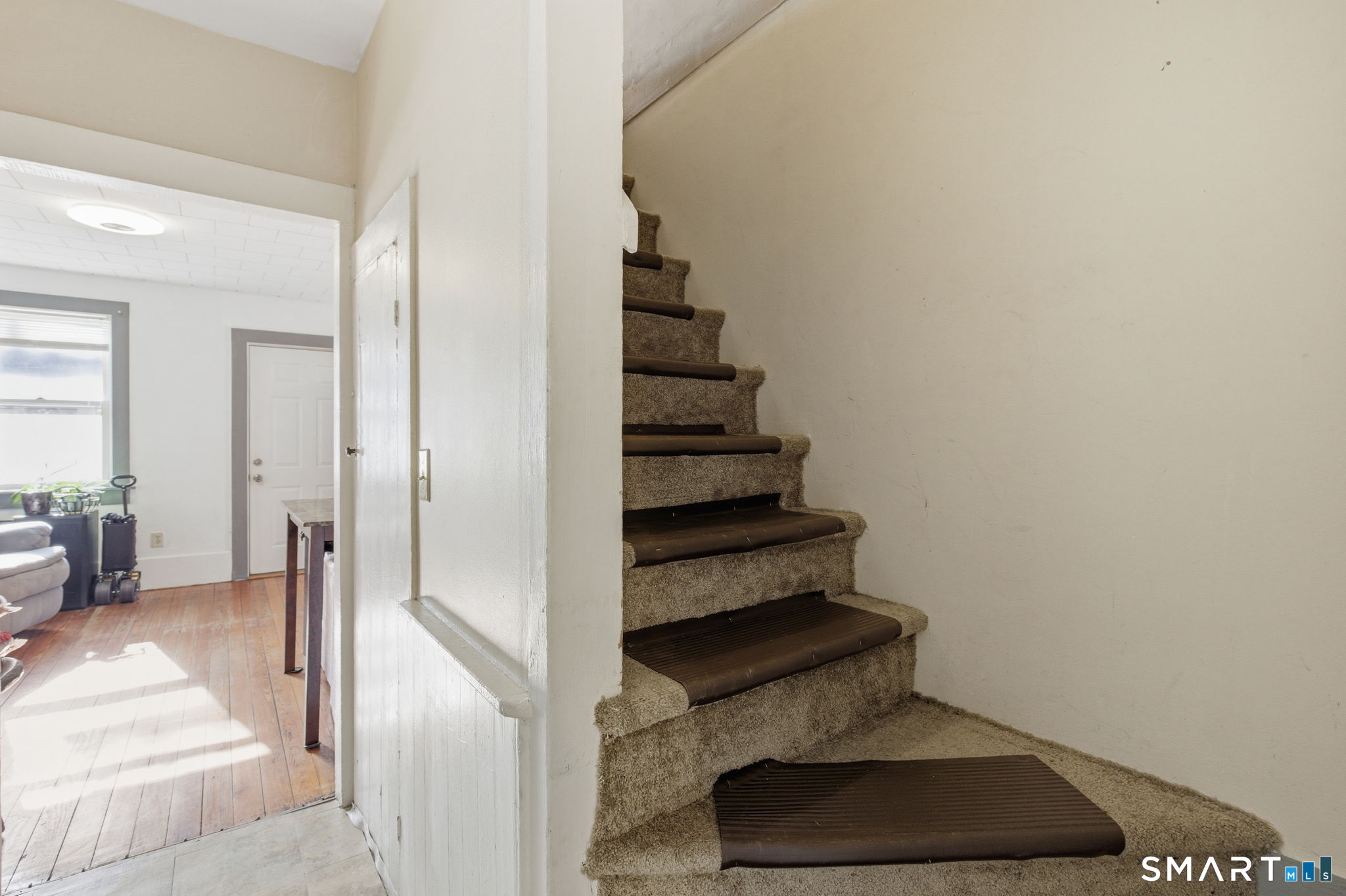 Undisclosed Address Vernon, CT 06066 - Photo 25 of 31 a view of entryway and hall with wooden floor