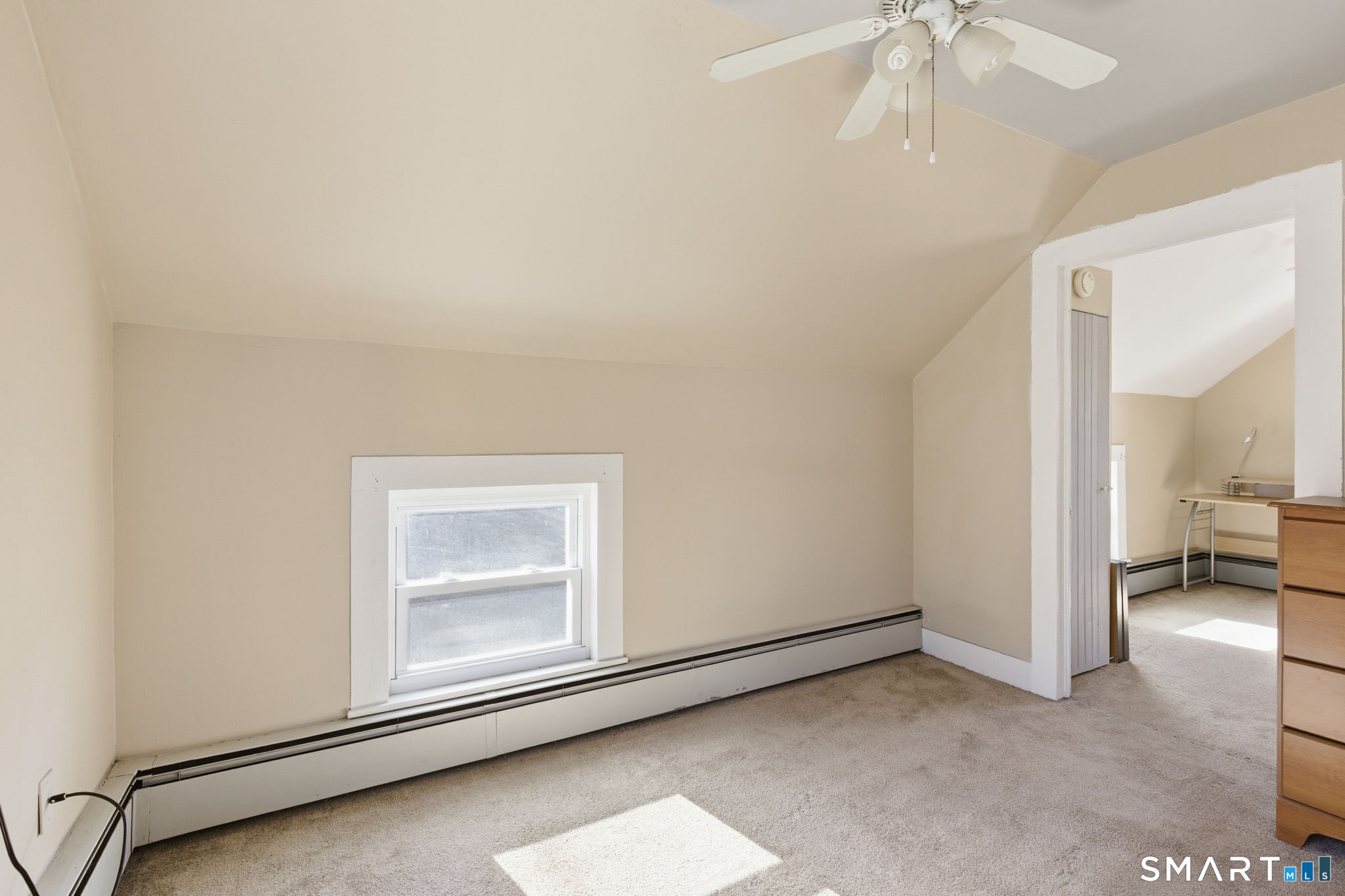 Undisclosed Address Vernon, CT 06066 - Photo 7 of 31 an empty room with a chandelier fan and windows