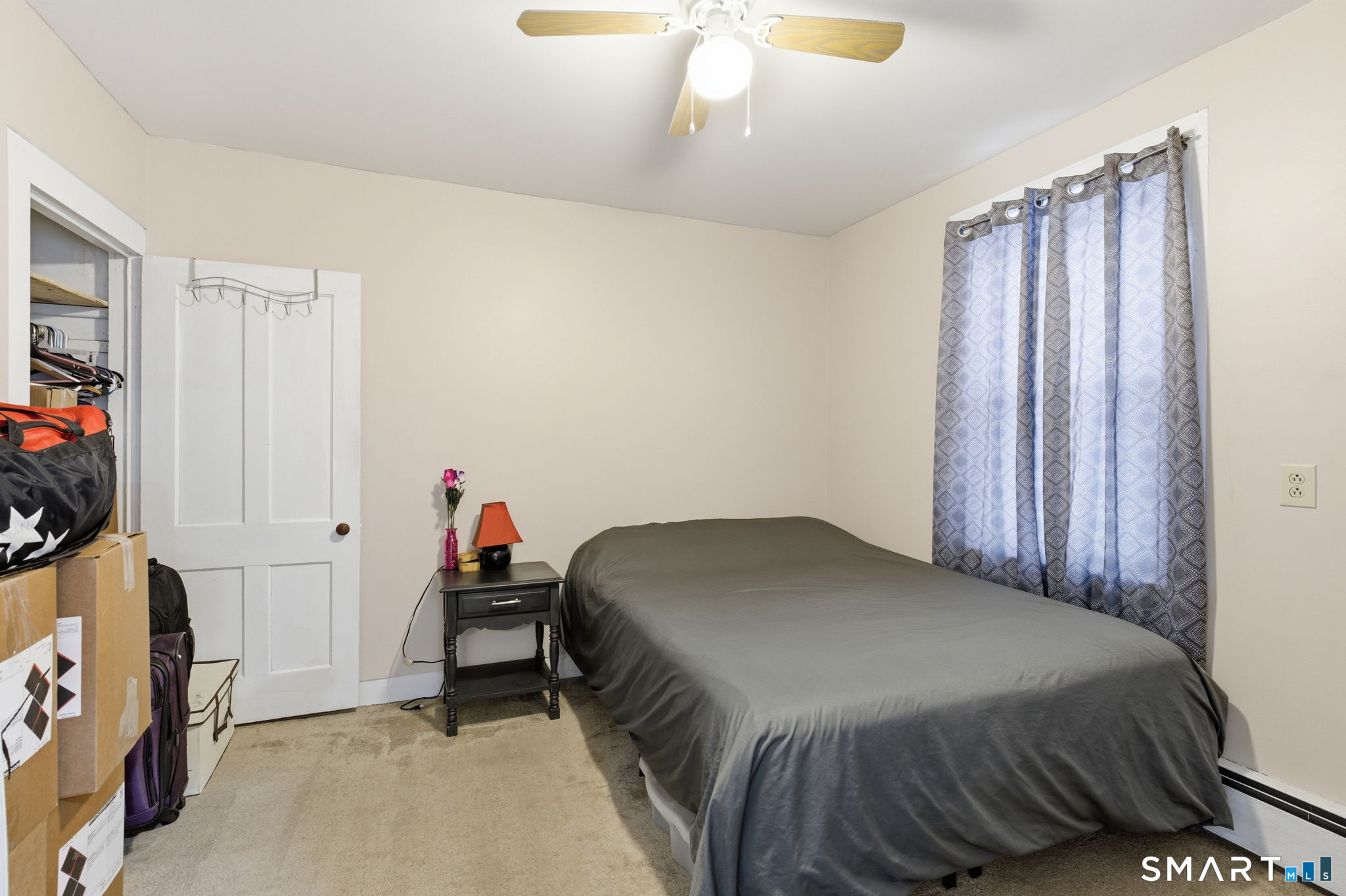 Undisclosed Address Vernon, CT 06066 - Photo 10 of 31 a bedroom with a bed and a flat tv screen