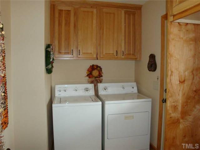 410 Emerson Cook Road Pittsboro, NC 27312 - Photo 8 of 25 Large laundry room can also dual as a mud room.