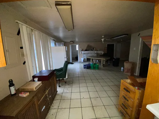 a lobby with furniture and a flat screen tv