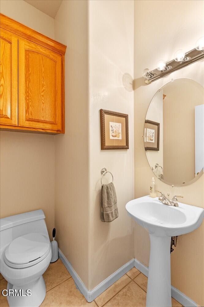 26450 Cumberland Road Tehachapi, CA 93561 - Photo 11 of 52 a bathroom with a sink and a toilet