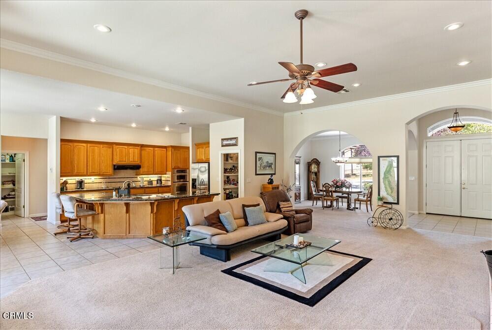 26450 Cumberland Road Tehachapi, CA 93561 - Photo 13 of 52 a living room with furniture kitchen view and a chandelier