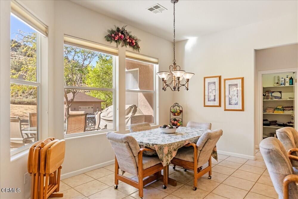 26450 Cumberland Road Tehachapi, CA 93561 - Photo 16 of 52 a view of a dining room with furniture window and outside view