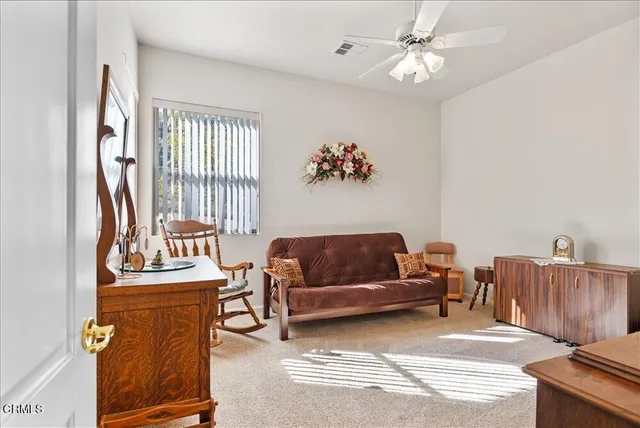 a bedroom with furniture and a chandelier
