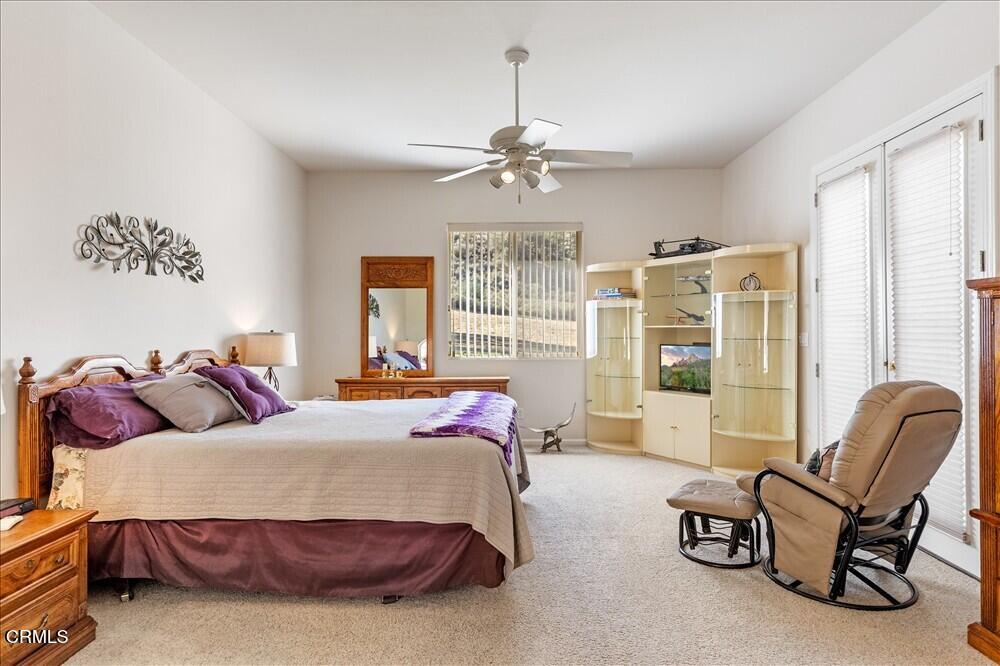 26450 Cumberland Road Tehachapi, CA 93561 - Photo 34 of 52 a bedroom with a bed and a couch