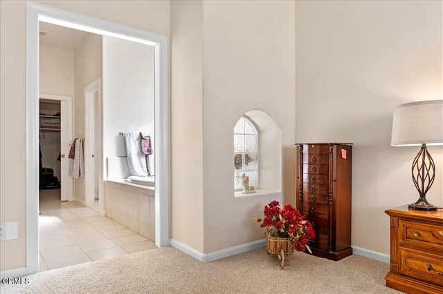 a bathroom with a tub sink and a mirror