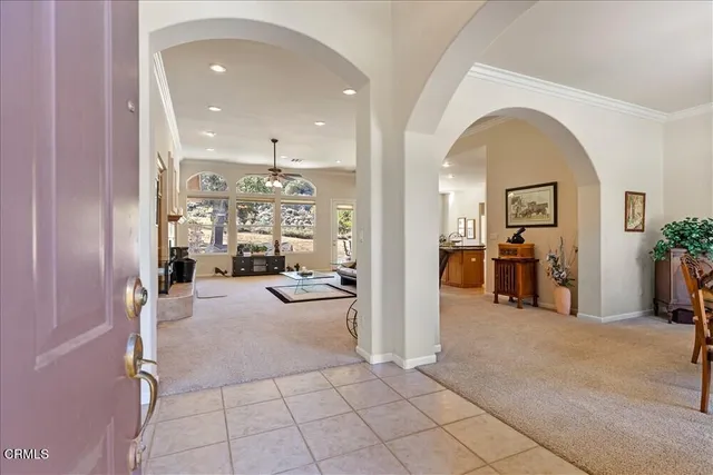 a room with a window and a chandelier