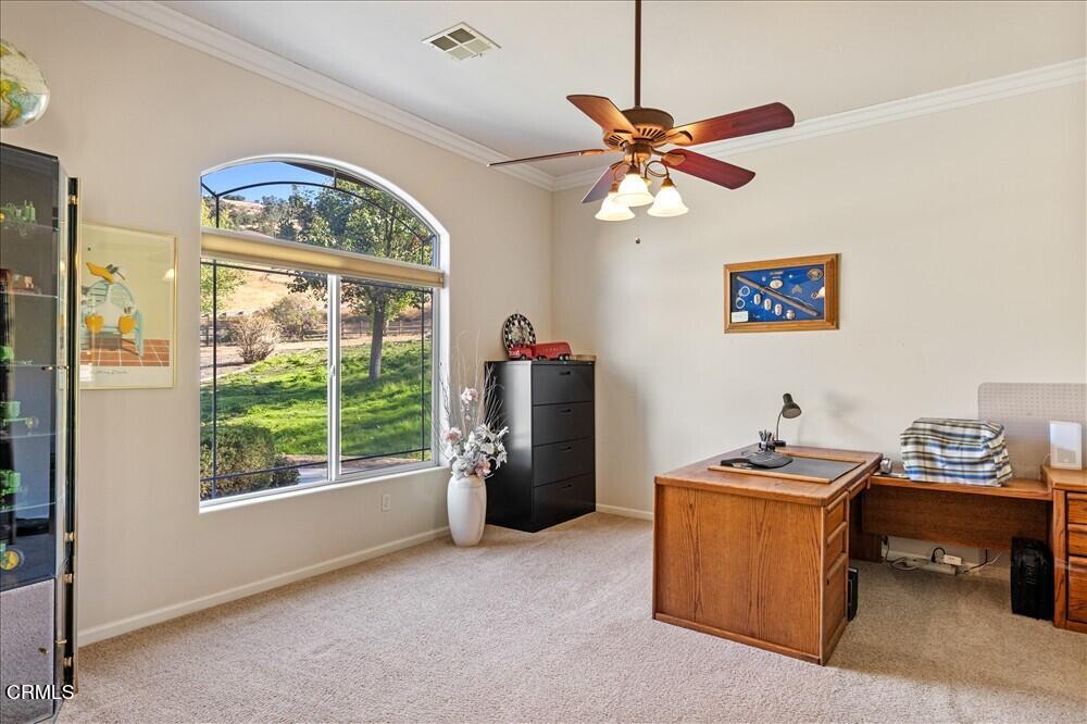 26450 Cumberland Road Tehachapi, CA 93561 - Photo 6 of 52 a room with a window and a chandelier
