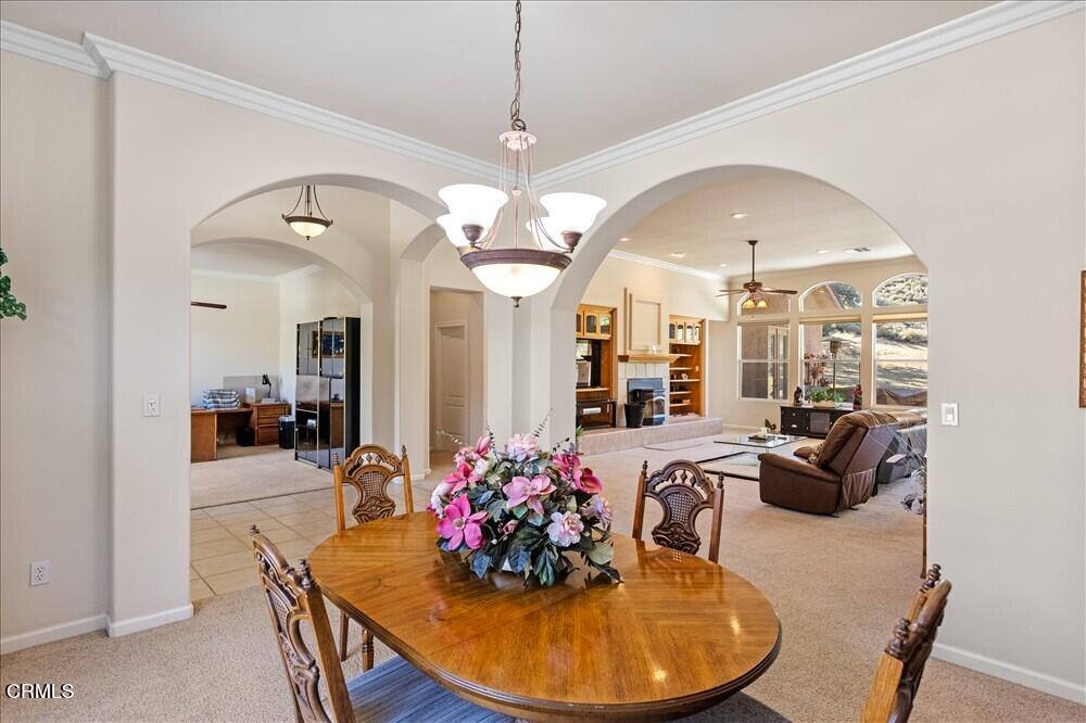 26450 Cumberland Road Tehachapi, CA 93561 - Photo 9 of 52 a view of a dining room with furniture and chandelier