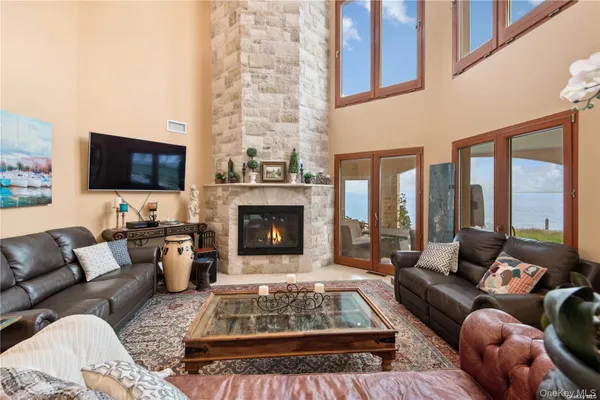 a living room with furniture fireplace and a flat screen tv