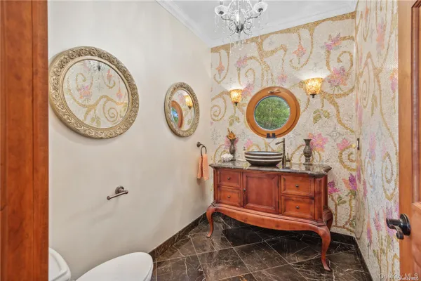 a bathroom with a toilet and a sink