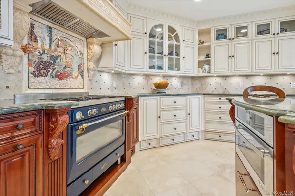 a kitchen with stainless steel appliances granite countertop a stove and a sink