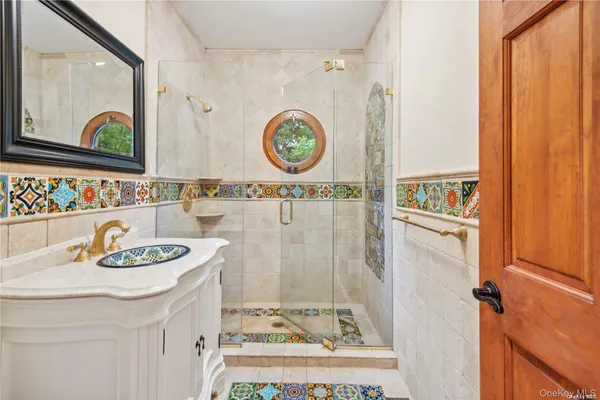 a bathroom with a sink and a mirror