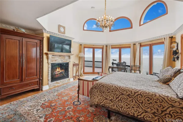 a bedroom with a bed and a fireplace