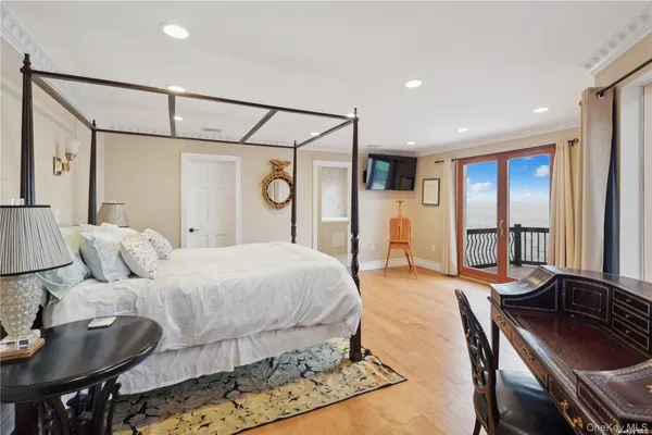 a bedroom with a bed and a table