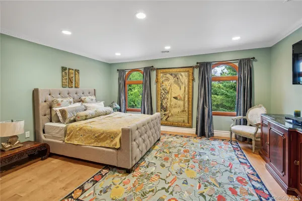 a spacious bedroom with a large bed and a couch