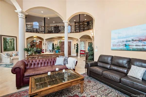 a living room with furniture flowerpot and window