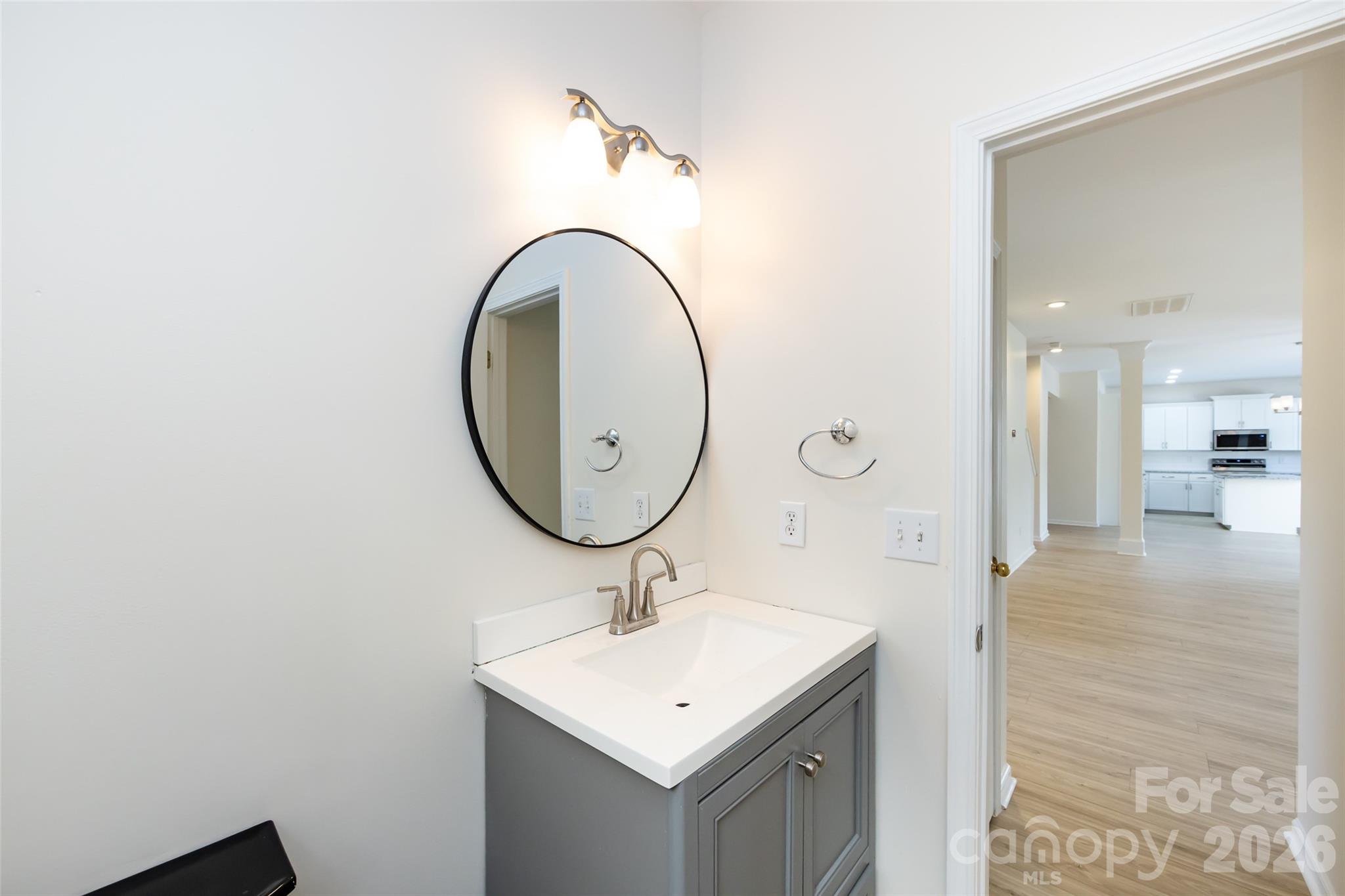 2705 Gosling Terrace Road Charlotte, NC 28262 - Photo 12 of 36 a bathroom with a sink and a mirror