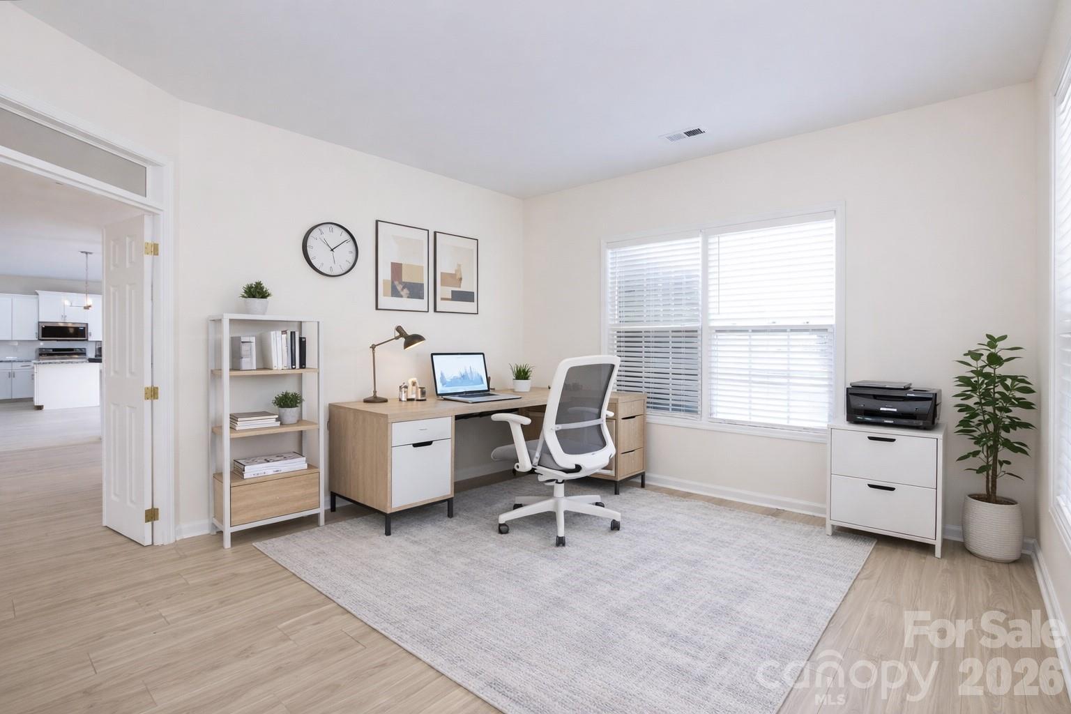 2705 Gosling Terrace Road Charlotte, NC 28262 - Photo 17 of 36 a view of a workspace with furniture and a window