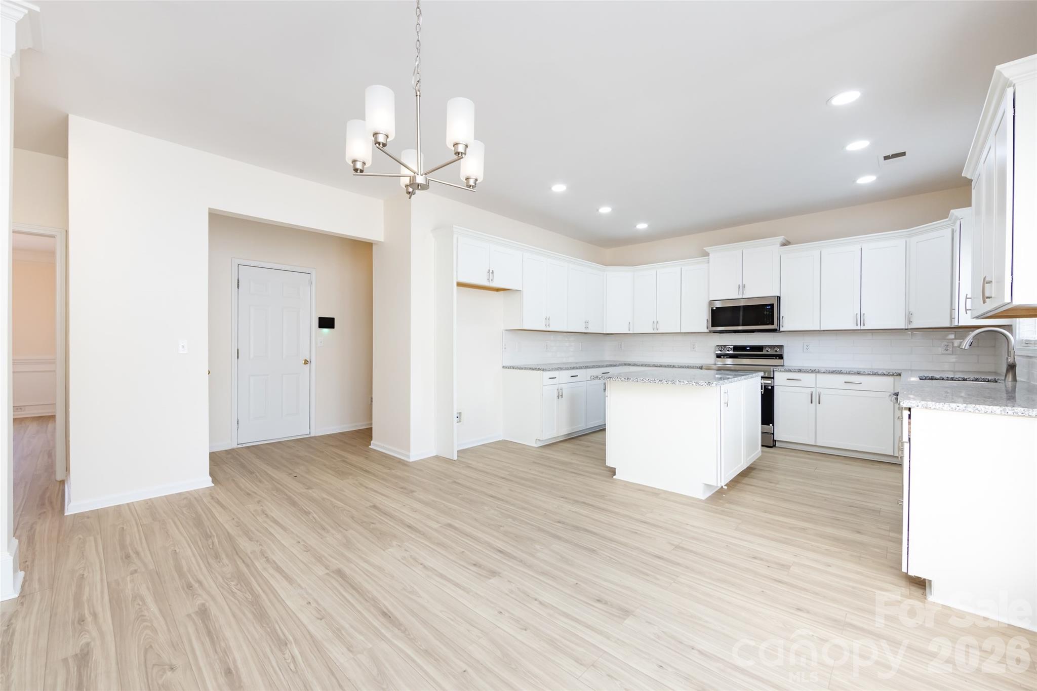 2705 Gosling Terrace Road Charlotte, NC 28262 - Photo 21 of 36 a view of kitchen with granite countertop cabinets and refrigerator
