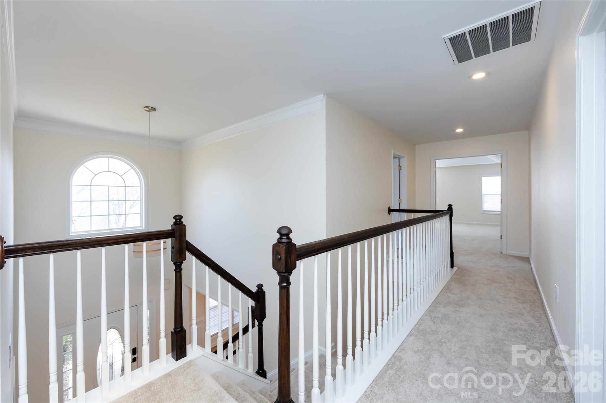 2705 Gosling Terrace Road Charlotte, NC 28262 - Photo 31 of 36 a view of a hallway with windows and stairs