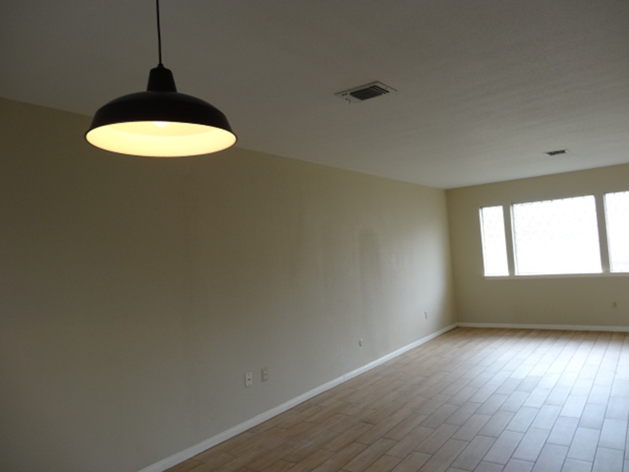 5522 Deep Forest Drive Houston, TX 77092 - Photo 11 of 47 wooden floor in an empty room with a window