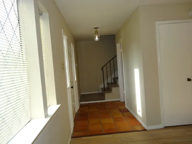 a bathroom with a tub and shower