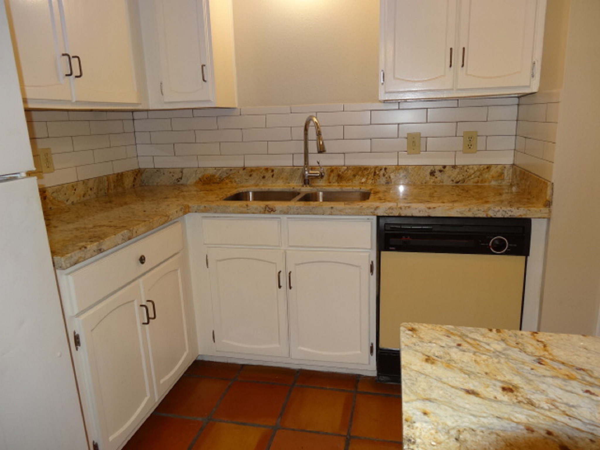 5522 Deep Forest Drive Houston, TX 77092 - Photo 2 of 47 a kitchen with white cabinets and sink