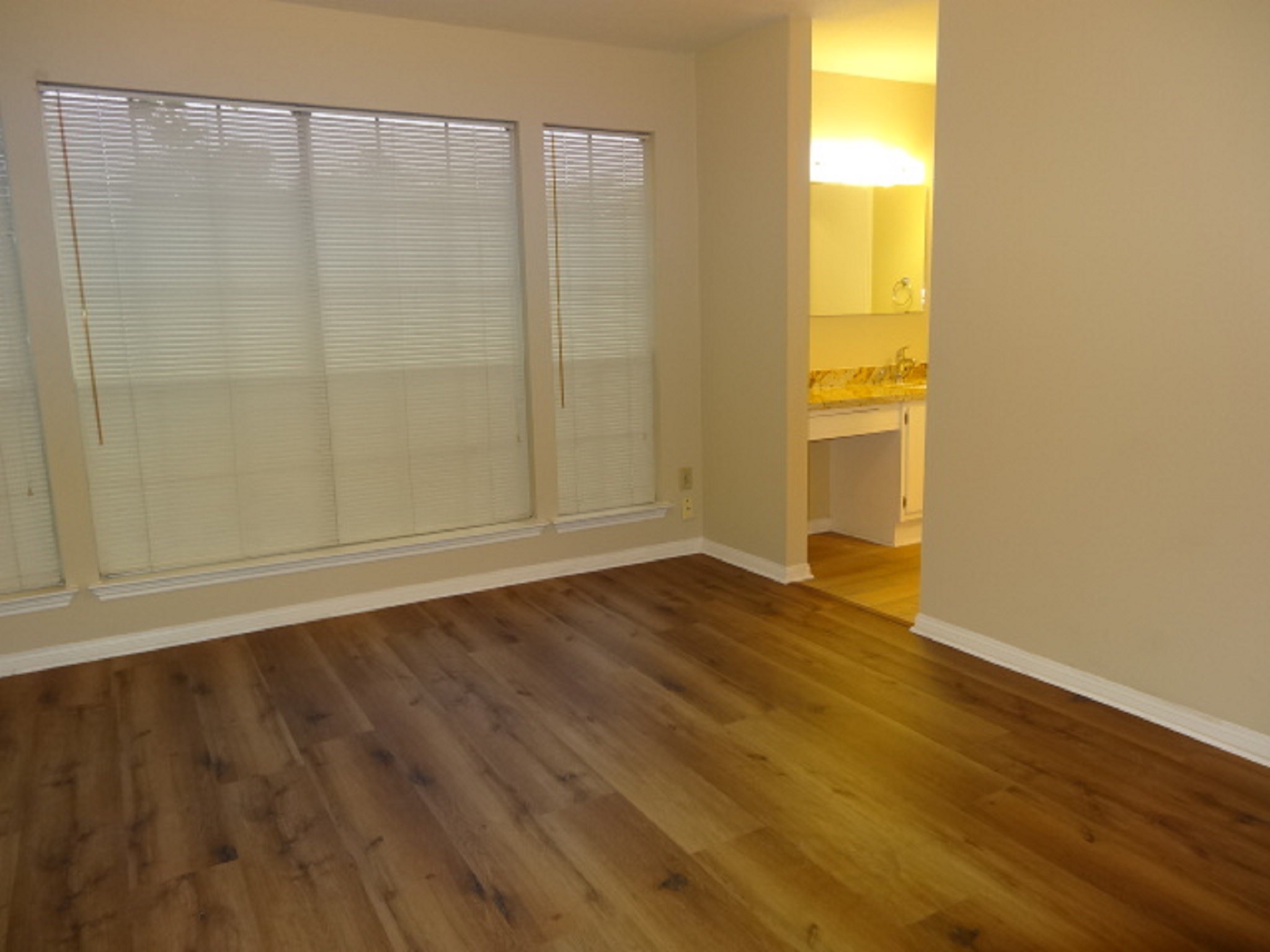 5522 Deep Forest Drive Houston, TX 77092 - Photo 31 of 47 a view of an empty room with wooden floor and a window