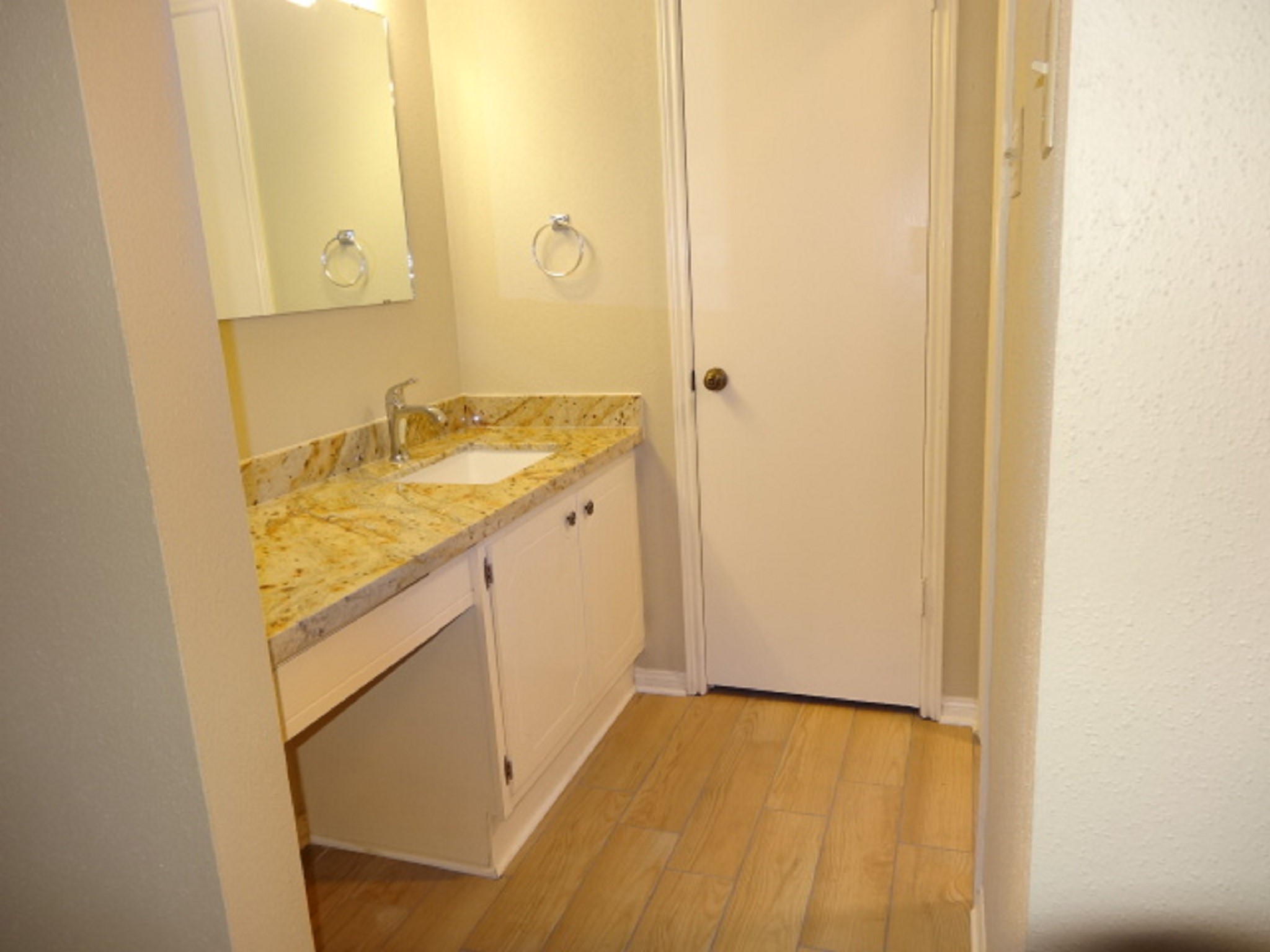 5522 Deep Forest Drive Houston, TX 77092 - Photo 32 of 47 a bathroom with a granite countertop sink and a mirror