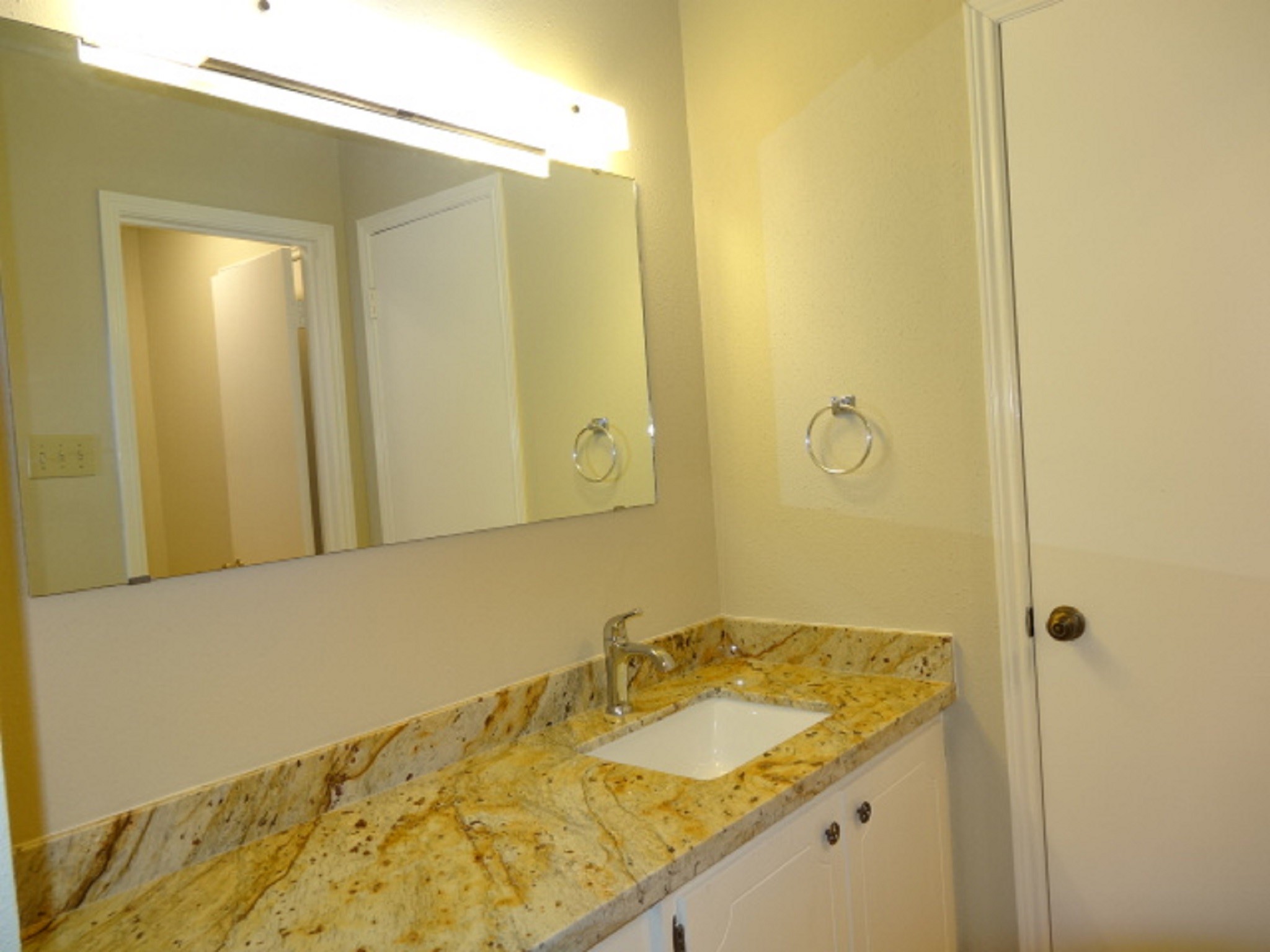 5522 Deep Forest Drive Houston, TX 77092 - Photo 33 of 47 a bathroom with a granite countertop sink and a mirror