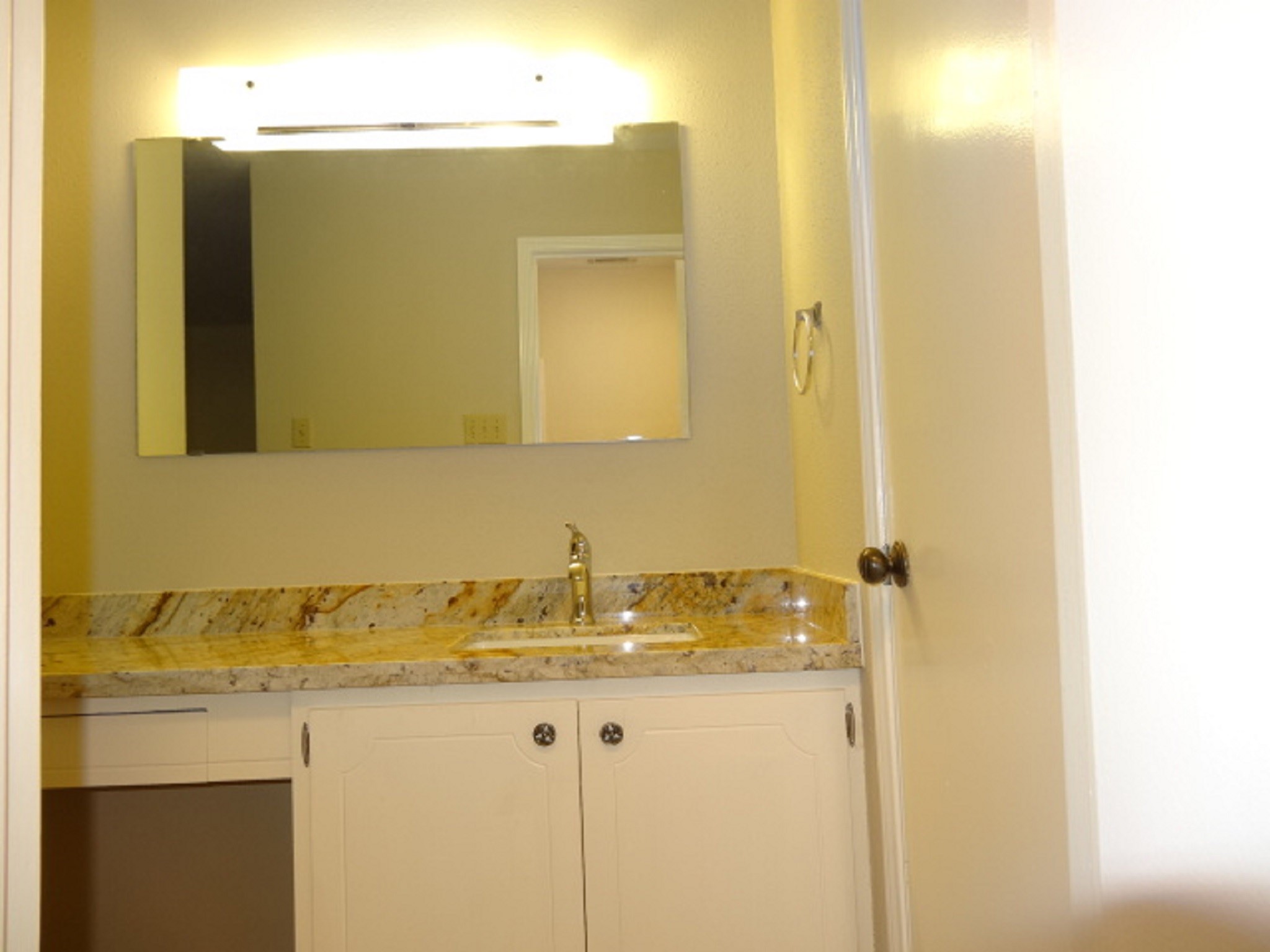5522 Deep Forest Drive Houston, TX 77092 - Photo 34 of 47 a bathroom with a granite countertop sink and a mirror