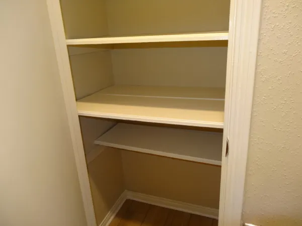a view of a backyard with wooden fence