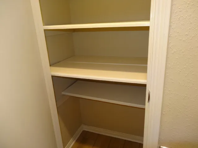 a view of a hallway with a shower