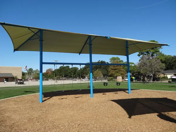an outdoor space with furniture and umbrella