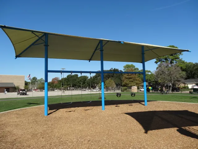 an outdoor space with furniture and umbrella