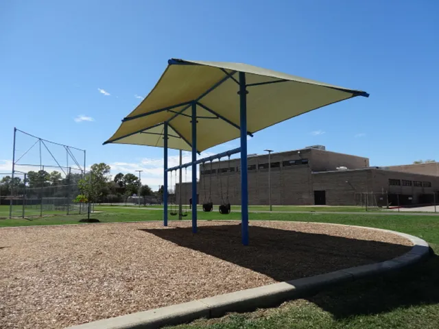 an outdoor space with furniture and umbrella